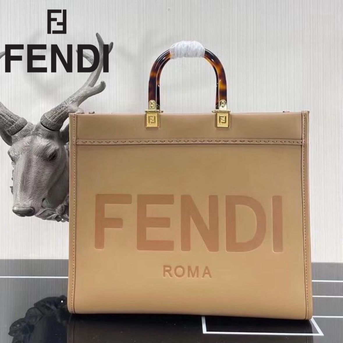 FENDI METAL INITIAL ON SLING BELT