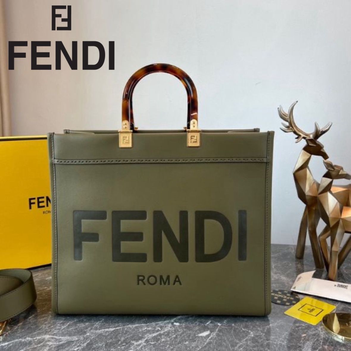 FENDI METAL INITIAL ON SLING BELT